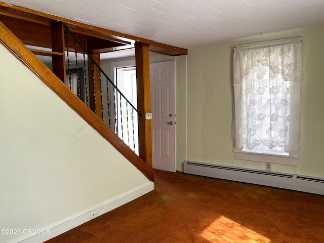 433 E 6th St, Berwick, PA 18603 - carpeted foyer with a baseboard radiator and stairs
