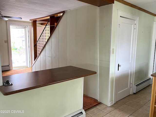 433 E 6th St, Berwick, PA 18603 - stairway with a baseboard radiator and tile patterned floors