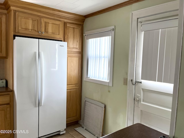 433 E 6th St, Berwick, PA 18603 - kitchen featuring freestanding refrigerator, crown molding, and brown cabinets