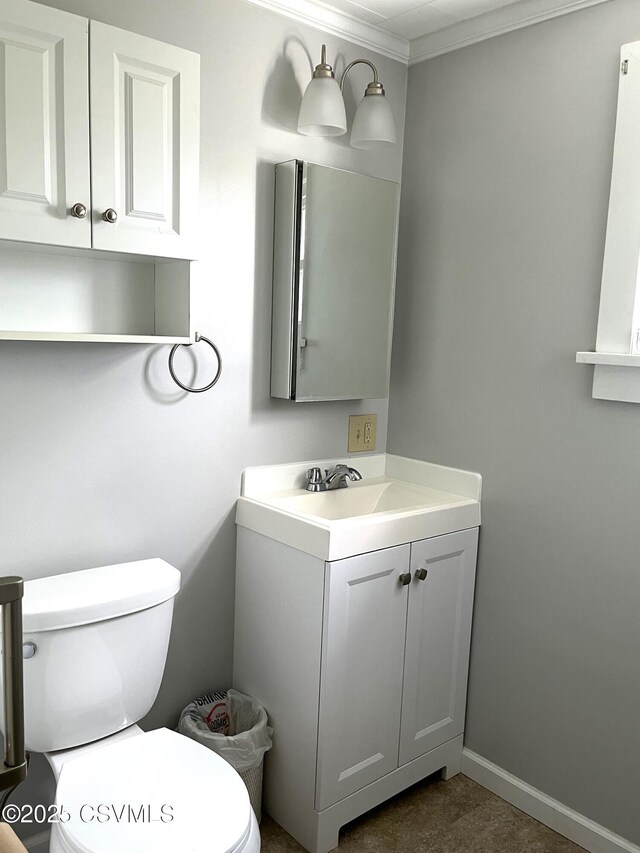 433 E 6th St, Berwick, PA 18603 - half bath with toilet, vanity, crown molding, and baseboards