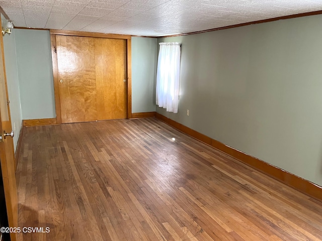 433 E 6th St, Berwick, PA 18603 - unfurnished bedroom featuring crown molding, hardwood / wood-style floors, and baseboards