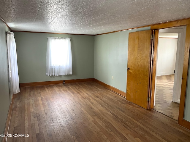 433 E 6th St, Berwick, PA 18603 - empty room featuring ornamental molding, wood-type flooring, and baseboards