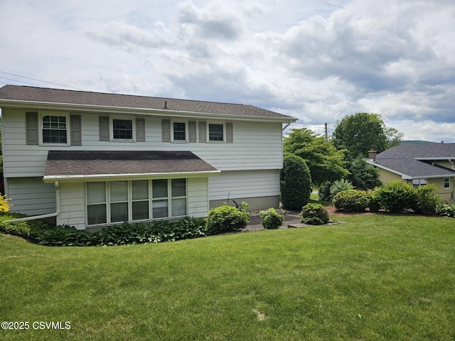 1605 W Montgomery St, Coal Township, PA 17866 - rear view of property with a yard and roof with shingles
