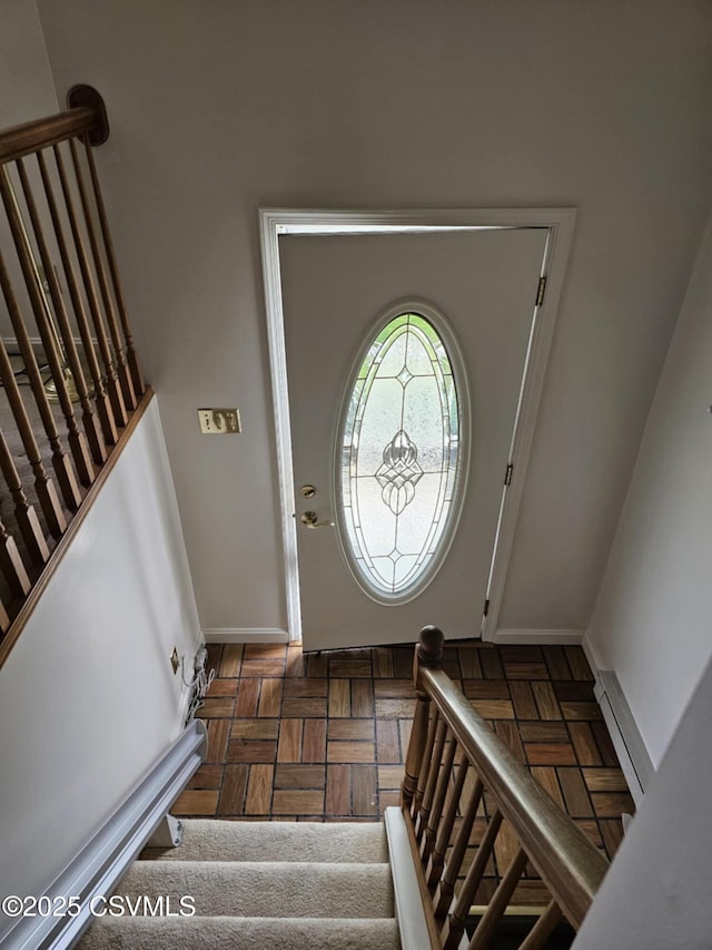 1605 W Montgomery St, Coal Township, PA 17866 - foyer entrance with stairs, baseboards, and a baseboard heating unit