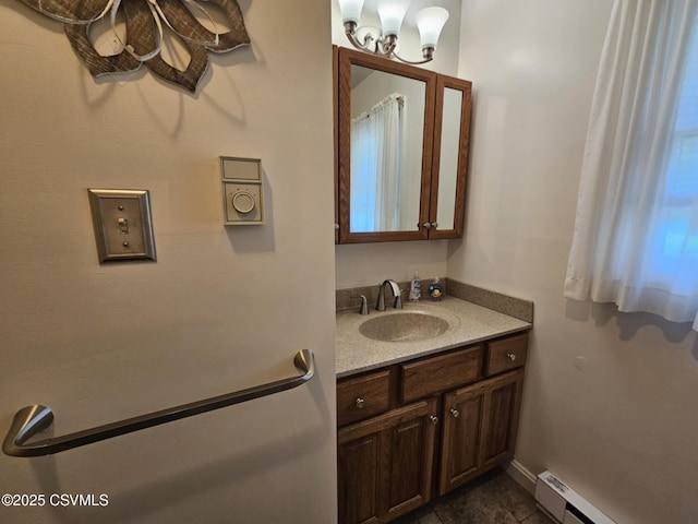 1605 W Montgomery St, Coal Township, PA 17866 - bathroom with a baseboard heating unit, vanity, a chandelier, and tile patterned flooring