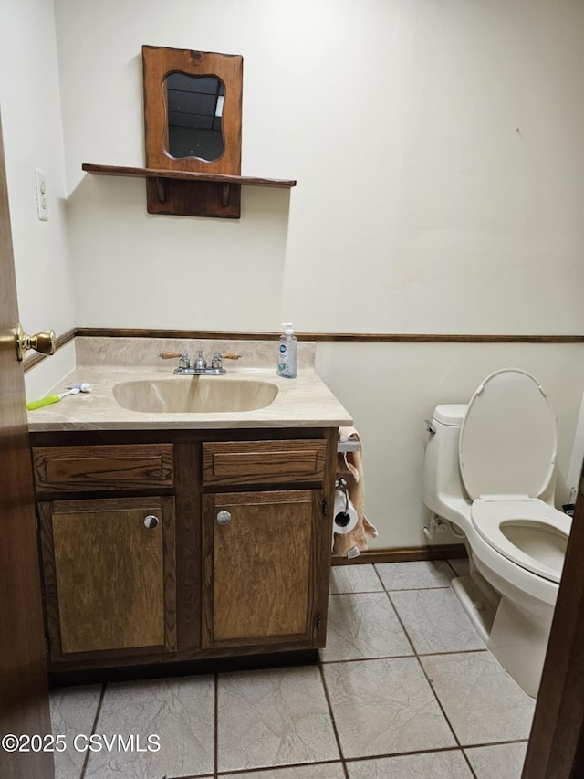 1605 W Montgomery St, Coal Township, PA 17866 - bathroom featuring vanity, toilet, and baseboards