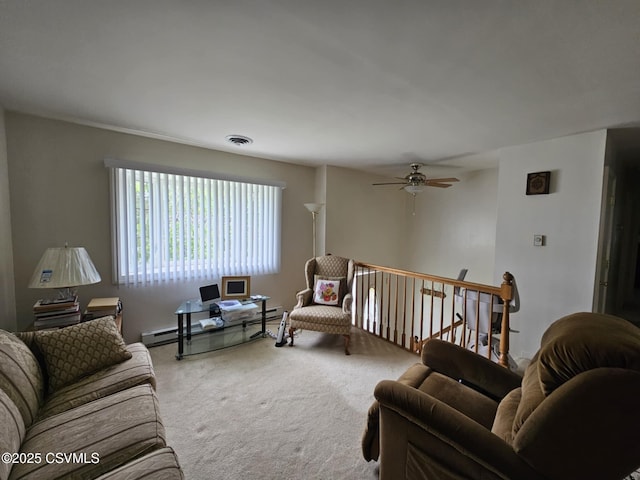 1605 W Montgomery St, Coal Township, PA 17866 - living area featuring carpet, ceiling fan, and baseboard heating