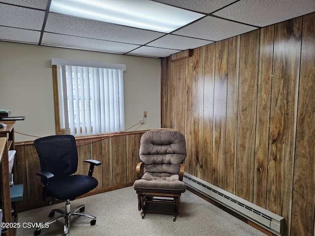 1605 W Montgomery St, Coal Township, PA 17866 - office space featuring a baseboard heating unit, wood walls, a paneled ceiling, and carpet