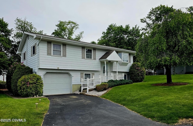 1605 W Montgomery St, Coal Township, PA 17866 - split foyer home with a garage, driveway, and a front yard