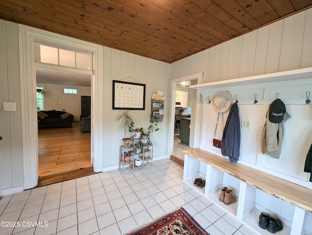 2852 State Route 487, Orangeville, PA 17859 - mudroom with light tile patterned flooring, wooden ceiling, and wood walls
