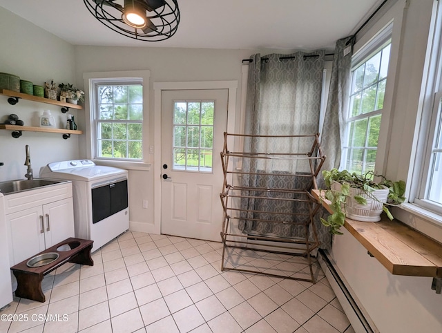 2852 State Route 487, Orangeville, PA 17859 - laundry room featuring light tile patterned floors, washer and clothes dryer, a baseboard radiator, and a baseboard heating unit