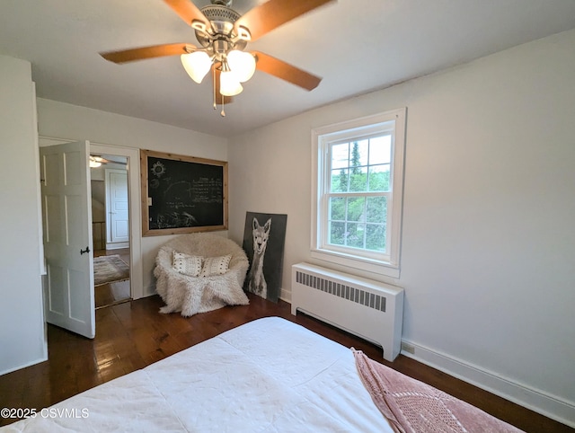 2852 State Route 487, Orangeville, PA 17859 - bedroom with radiator, wood finished floors, baseboards, and ceiling fan
