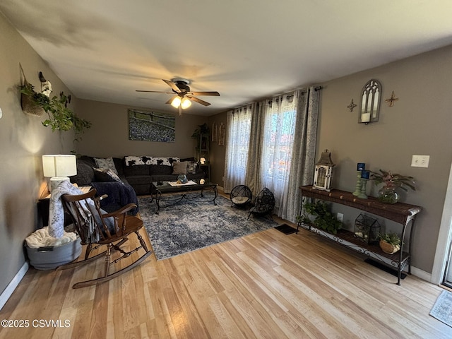 220 Spring Lake Crst, Watsontown, PA 17777 - living area featuring wood finished floors, ceiling fan, and baseboards