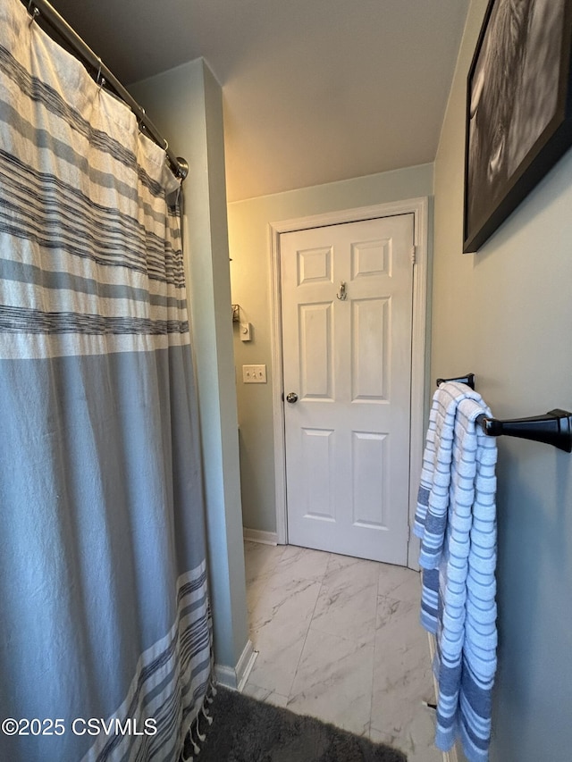 220 Spring Lake Crst, Watsontown, PA 17777 - full bath with marble look tiles, baseboards, and curtained shower