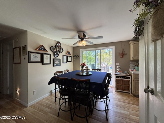 220 Spring Lake Crst, Watsontown, PA 17777 - dining area with light wood-style floors, ceiling fan, and baseboards