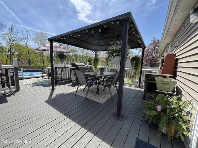 220 Spring Lake Crst, Watsontown, PA 17777 - deck featuring a gazebo, outdoor dining space, and an outdoor pool