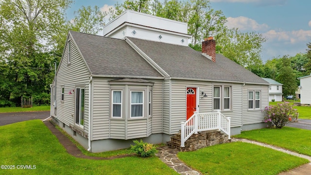 475 W 1st St, Bloomsburg, PA 17815 - view of front of house featuring a chimney, a front yard, and roof with shingles