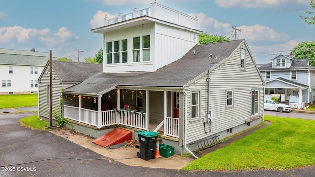 475 W 1st St, Bloomsburg, PA 17815 - view of front of home featuring roof with shingles, a porch, and a front yard