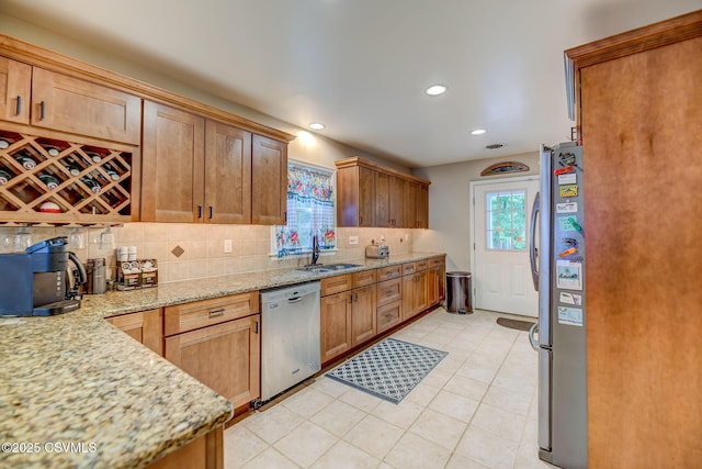 475 W 1st St, Bloomsburg, PA 17815 - kitchen featuring stainless steel appliances, a sink, decorative backsplash, light stone counters, and recessed lighting