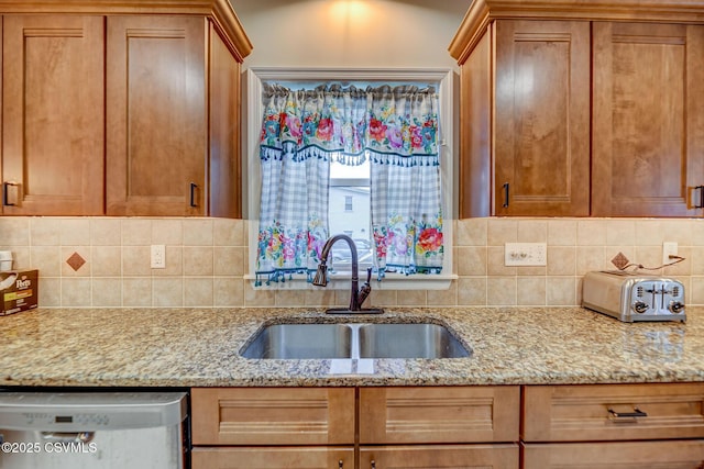 475 W 1st St, Bloomsburg, PA 17815 - kitchen with stainless steel dishwasher, a sink, tasteful backsplash, and light stone countertops