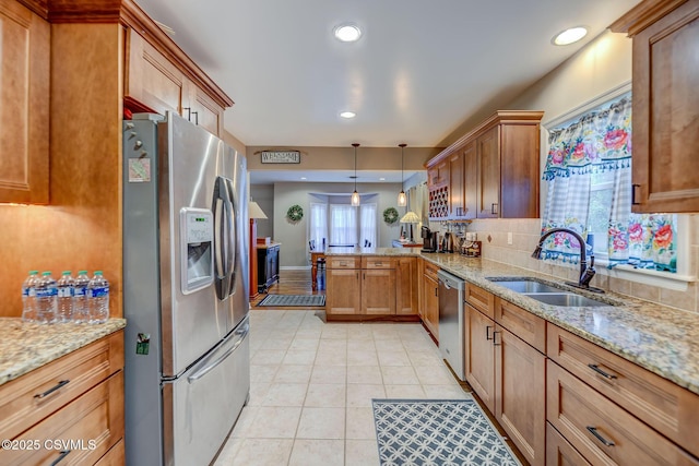 475 W 1st St, Bloomsburg, PA 17815 - kitchen featuring stainless steel appliances, a peninsula, a sink, light stone countertops, and recessed lighting