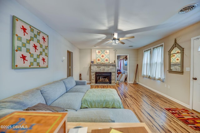 475 W 1st St, Bloomsburg, PA 17815 - living room featuring a ceiling fan, wood finished floors, baseboards, and a fireplace