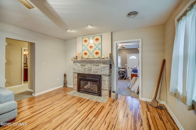 475 W 1st St, Bloomsburg, PA 17815 - living room with light wood-style flooring, baseboards, and a fireplace