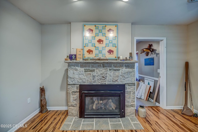 475 W 1st St, Bloomsburg, PA 17815 - detailed view of wood finished floors, a stone fireplace, and baseboards
