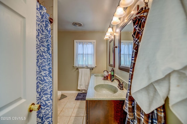 475 W 1st St, Bloomsburg, PA 17815 - bathroom with vanity, tile patterned floors, baseboards, and toilet