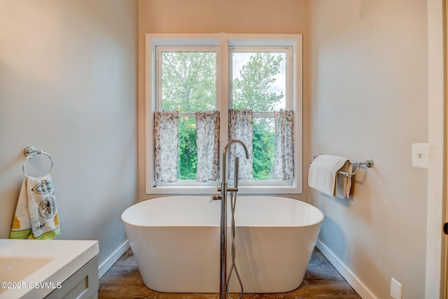 475 W 1st St, Bloomsburg, PA 17815 - full bath featuring vanity, a soaking tub, and healthy amount of natural light