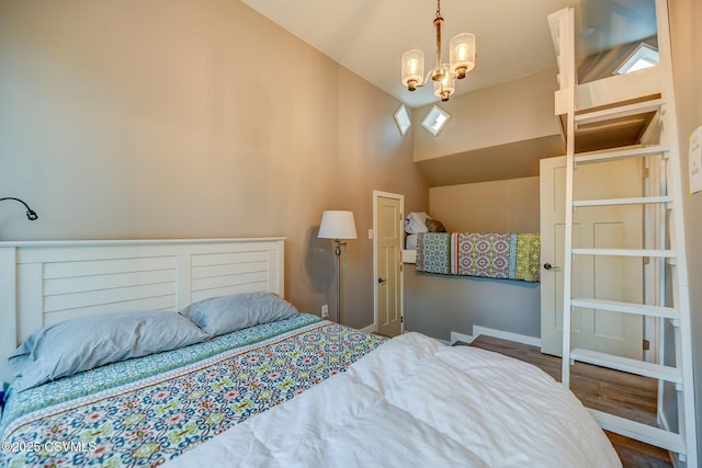 475 W 1st St, Bloomsburg, PA 17815 - bedroom featuring lofted ceiling, wood finished floors, a chandelier, and baseboards