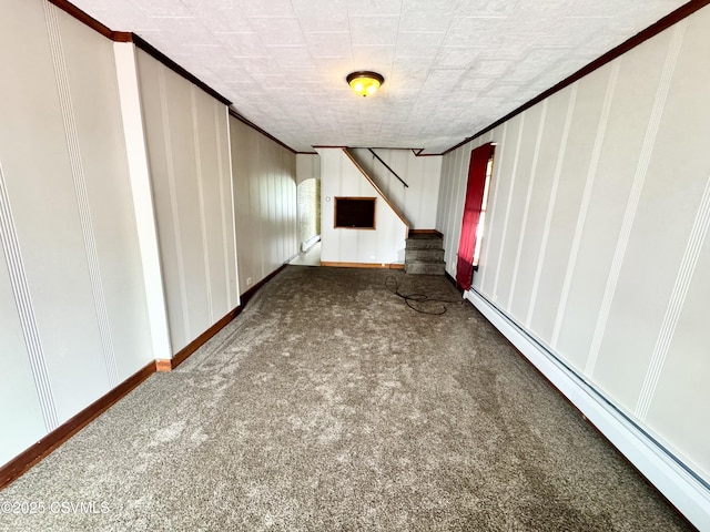 338 W Saylor St, Atlas, PA 17851 - basement featuring a baseboard heating unit, carpet floors, ornamental molding, stairs, and a decorative wall