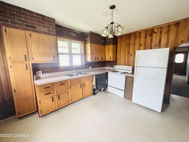 338 W Saylor St, Atlas, PA 17851 - kitchen with white appliances, a sink, light countertops, a chandelier, and hanging light fixtures