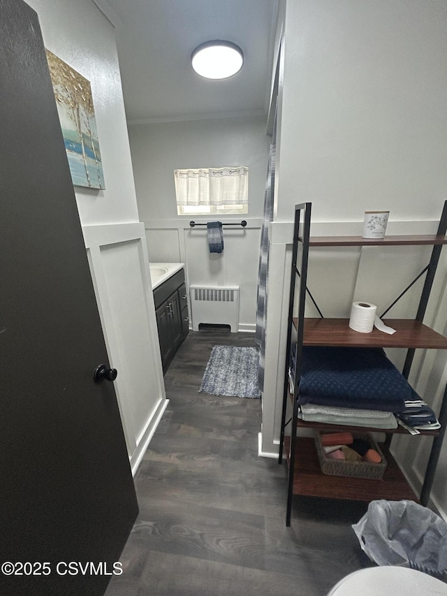 1644 W Walnut St, Coal Township, PA 17866 - bathroom featuring radiator, vanity, wood finished floors, and wainscoting