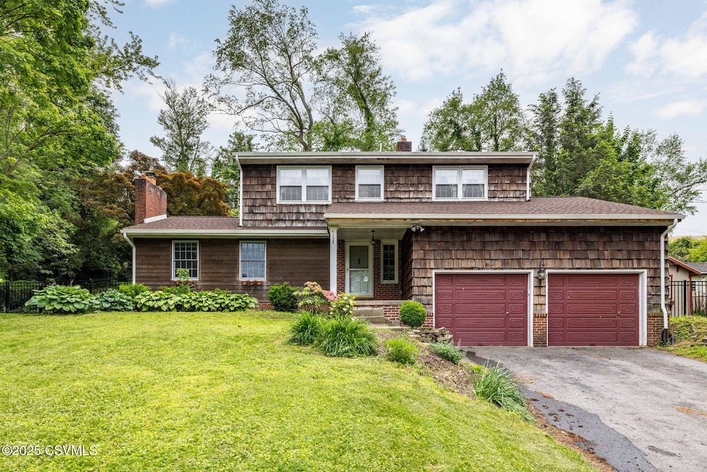 179 Hilltop Rd, Lewisburg, PA 17837 - view of front of house featuring a chimney, asphalt driveway, and a shingled roof