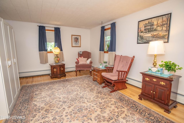2256 Crossroads Dr, Lewisburg, PA 17837 - living area featuring a baseboard radiator and wood finished floors