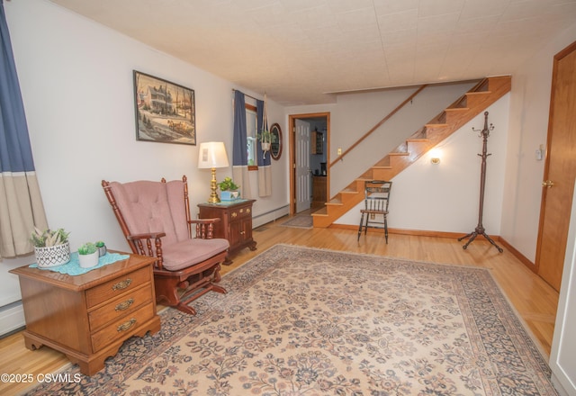 2256 Crossroads Dr, Lewisburg, PA 17837 - sitting room with wood finished floors, stairway, a baseboard radiator, and baseboards