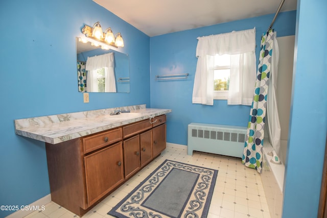 2256 Crossroads Dr, Lewisburg, PA 17837 - full bathroom featuring radiator heating unit, vanity, tile patterned floors, and shower / bath combo with shower curtain