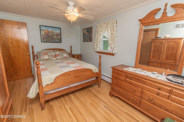 2256 Crossroads Dr, Lewisburg, PA 17837 - bedroom featuring ornamental molding, light wood-style flooring, a baseboard radiator, and ceiling fan