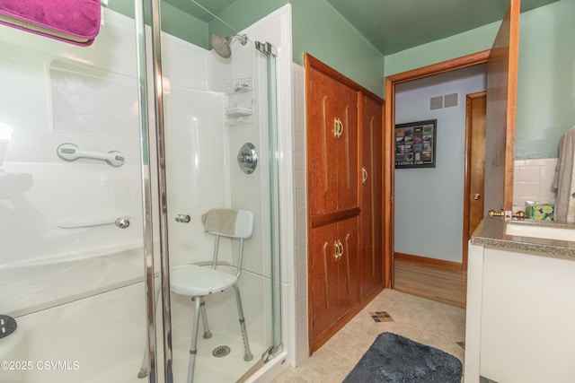 2256 Crossroads Dr, Lewisburg, PA 17837 - bathroom featuring a stall shower, tile patterned flooring, and vanity