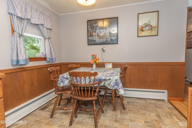 2256 Crossroads Dr, Lewisburg, PA 17837 - dining area with baseboard heating, a wainscoted wall, crown molding, and wooden walls