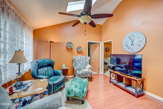 1207 E 5th St, Berwick, PA 18603 - living area with a ceiling fan, wood finished floors, baseboards, and high vaulted ceiling
