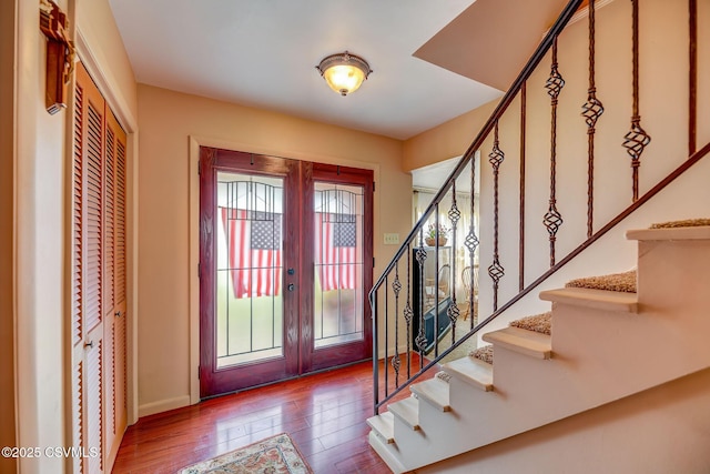 1207 E 5th St, Berwick, PA 18603 - entryway with french doors, stairs, wood finished floors, and baseboards