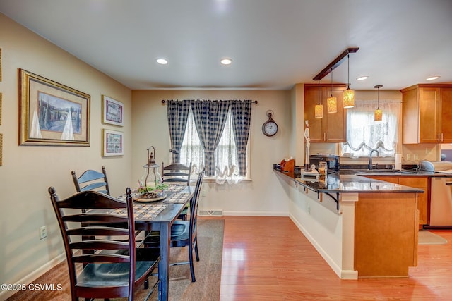 1207 E 5th St, Berwick, PA 18603 - dining space with light wood-style flooring, baseboards, and recessed lighting