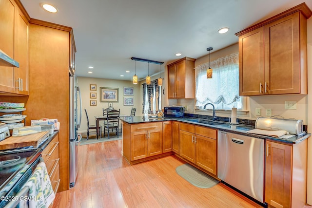 1207 E 5th St, Berwick, PA 18603 - kitchen featuring a sink, stainless steel appliances, brown cabinets, a peninsula, and recessed lighting