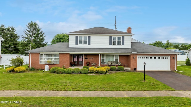 1207 E 5th St, Berwick, PA 18603 - traditional-style home featuring a chimney, a garage, covered porch, driveway, and brick siding