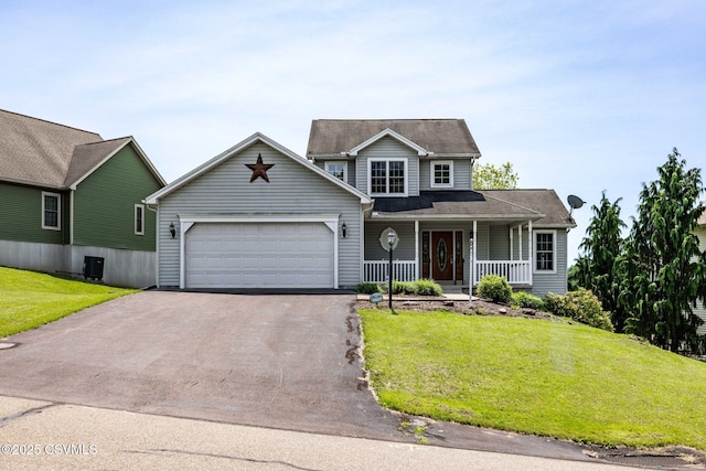 620 Sunset Dr, Bloomsburg, PA 17815 - traditional-style house featuring driveway, covered porch, an attached garage, and a front lawn