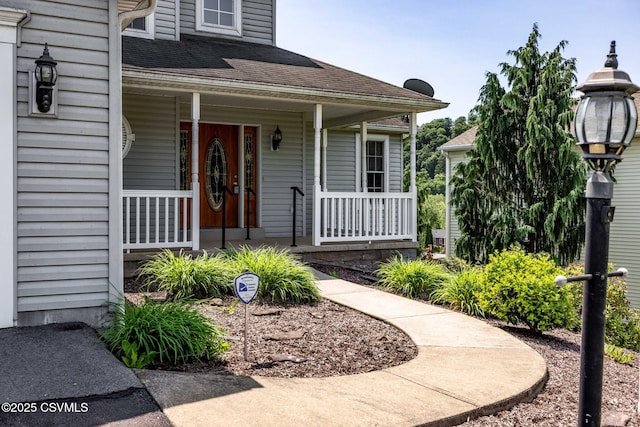 620 Sunset Dr, Bloomsburg, PA 17815 - property entrance featuring a porch and roof with shingles