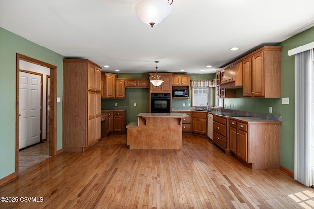 620 Sunset Dr, Bloomsburg, PA 17815 - kitchen featuring black appliances, light wood finished floors, brown cabinets, a sink, and recessed lighting