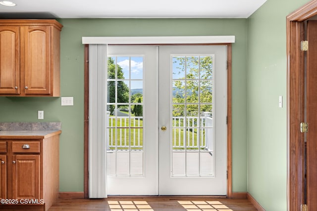 620 Sunset Dr, Bloomsburg, PA 17815 - doorway to outside featuring french doors, wood finished floors, and baseboards